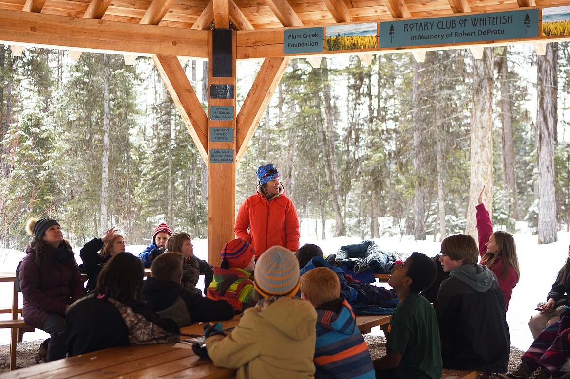 Kim Corette, education coordinator for the Whitefish trail, addresses sixth graders at the Whitefish Trail Learning Pavilion.