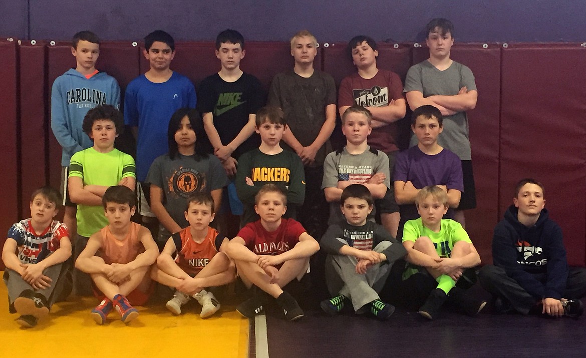 THE POLSON Little Guy Wrestling team poses after the won medals at the Little Guy Wrestling Tournament Saturday at Arlee High School. (from left, sitting): Izayus Prewett-Fahlgren, Brian Lyles, Cole Cross, TK Hawkins, Gavin Knutson, Colter Wilson, Owen McElwee; (Kneeling Row): Keyen Nash, Jaren Keene, Trent Wilson, Shane Calley, Brenden Griffin; (Standing Row): Jarrett Wilson, Justin Jordan, Tyren Stidham, Tristian Rauch, Kaden Blixt, and Aaron O&#146;Roake. (Photo by Jason Blasco/Lake County Leader)