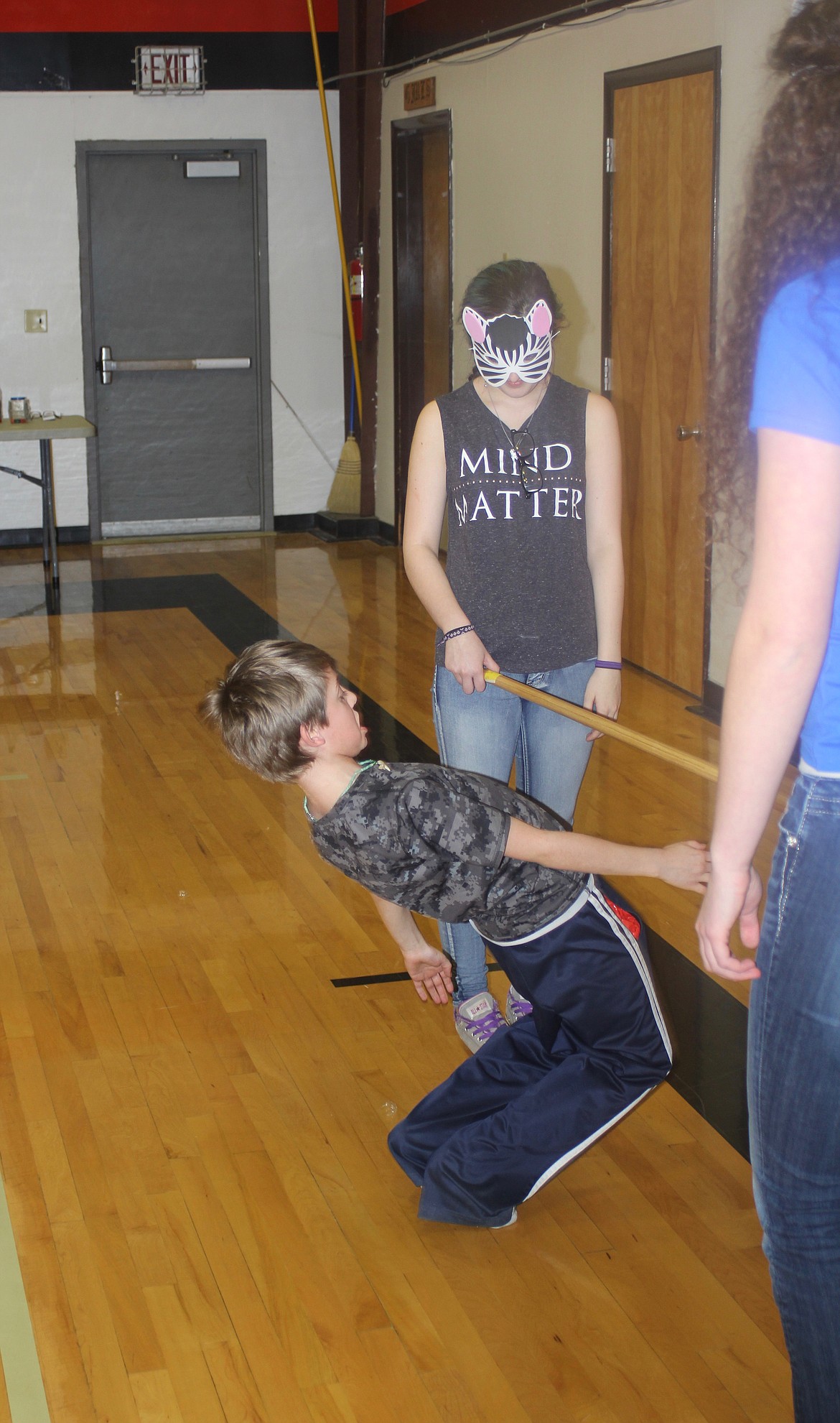 Jacob Lulack bends as low as he could go doing the limbo during the National Honor Society carnival held after school.