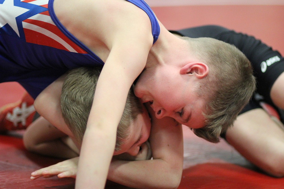 Clark Fork beginner Brandon Drey goes head-to-head against Plains wrestler Mathew Thurston at 55 pounds on Saturday. Drey went on to win the match.