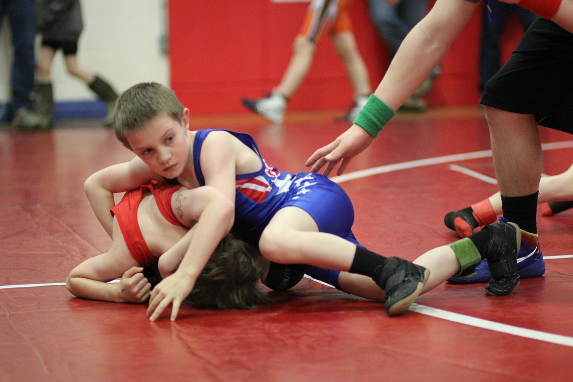 Beginner Clark Fork Gannon Quinlan won his match-up against a Missoula wrestler during Saturday&#146;s event in Superior. (Kathleen Woodford/Mineral Independent).