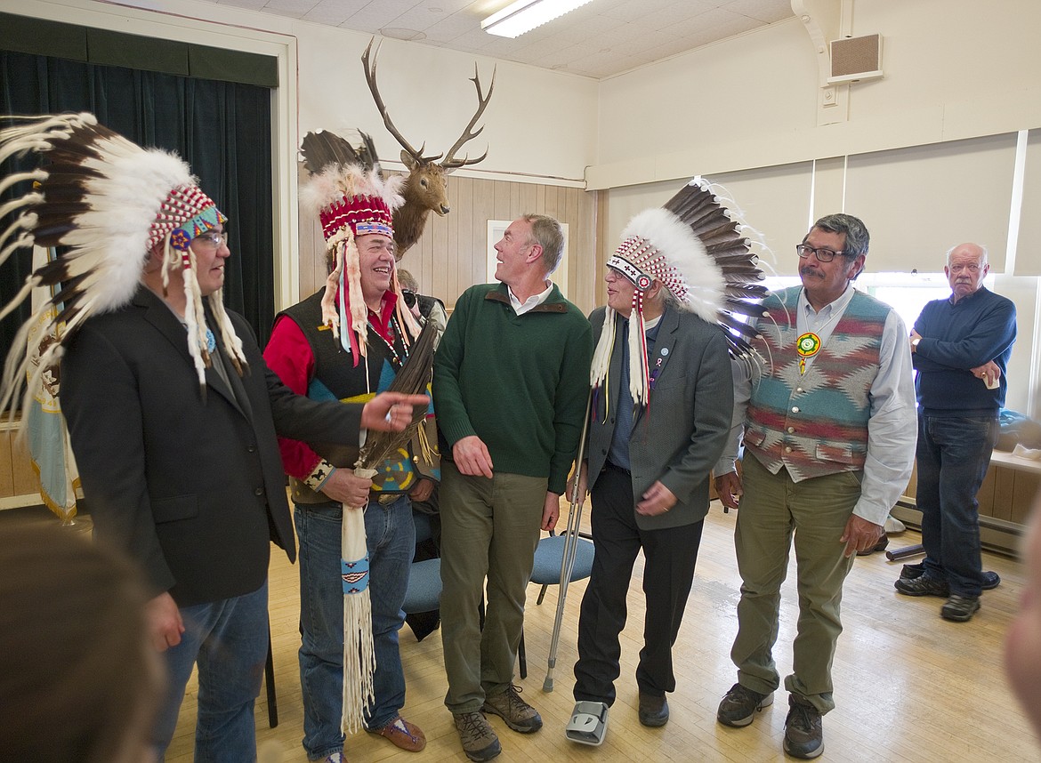 From left, Blackfeet Tribal members Tyson Runningwolf, Tim Davis, Sec. of of Interior Ryan Zinke, Tribal council President Harry Barnes and Carl Kipp joke during a photo op at Glacier Park&#146;s community building last week.