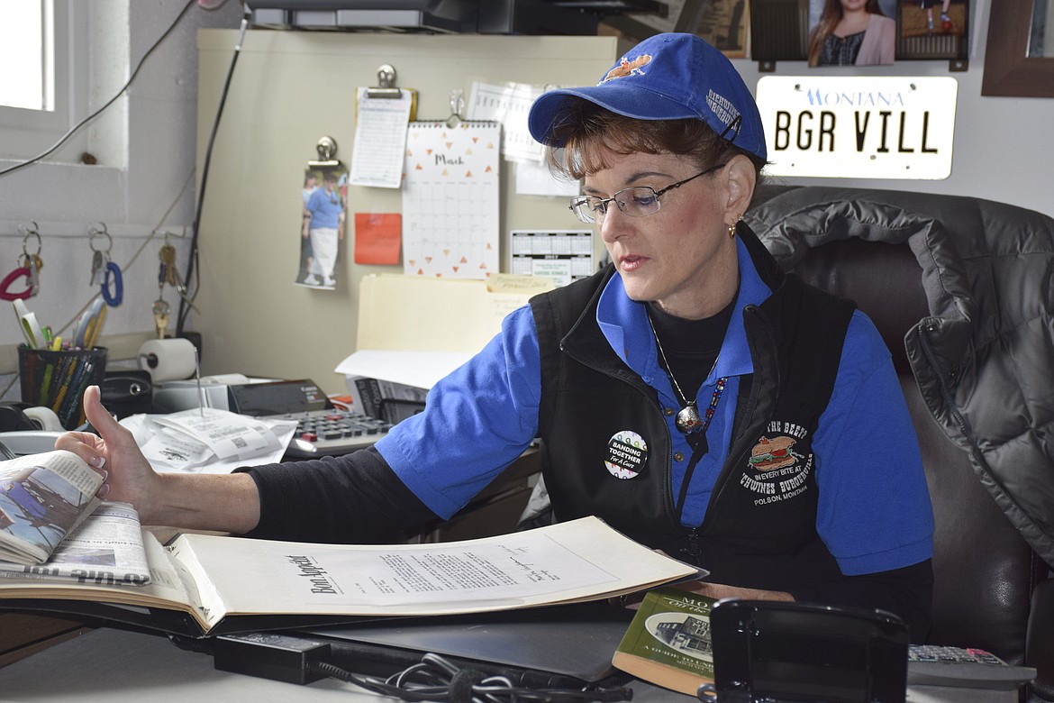 RICHWINE&#146;S BURGERVILLE owner Marcia Moen reads a letter from Bon Appetit magazine asking for the restaurant&#146;s burger recipe. A note written at the bottom by Moen&#146;s mother Lucy Richwine reads, &#147;We did not reply.&#148; (Brett Berntsen/Lake County Leader)