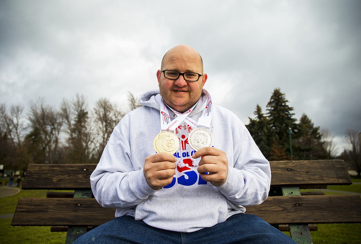 LOREN BENOIT/Press

Nathan Smalley, 30, of Coeur d'Alene, poses for a portrait with his Special Olympics World Winter Games medals Monday morning at Independence Point. Smalley competed in the advanced giant slalom in Austria, where he placed first, and the advanced slalom, where he placed second.