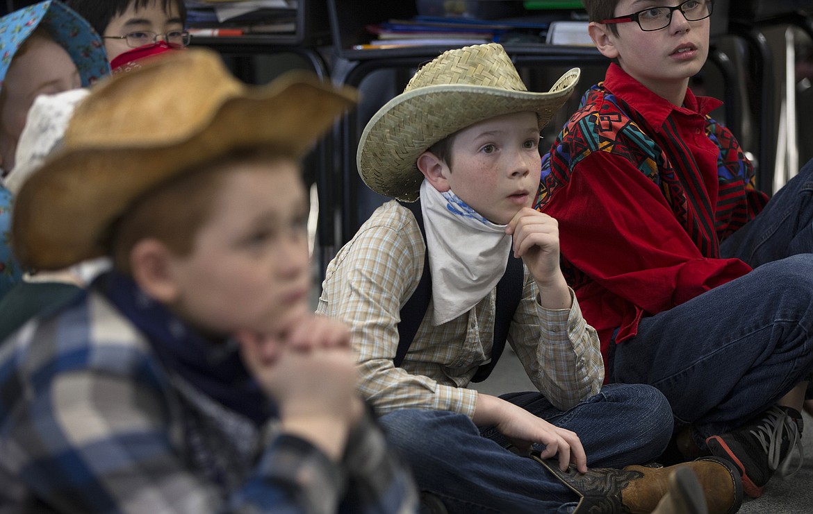 LISA JAMES/Press
Betty Kiefer Elementary School fourth-graders listen during their annual Pioneer Day on Friday. The students learned how the early pioneers survived by making their own food and clothing.