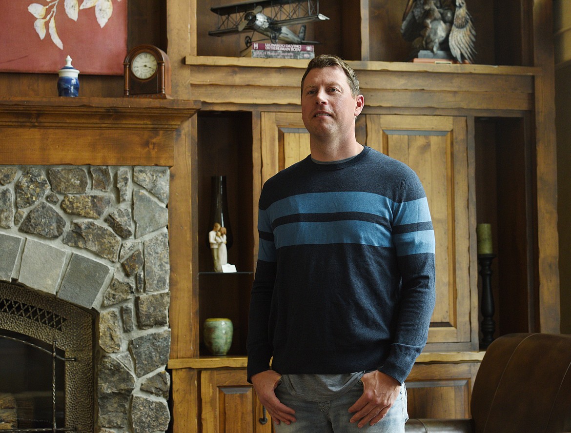 Chris Johnson stands in his home on Tuesday. (Aaric Bryan/Daily Inter Lake)