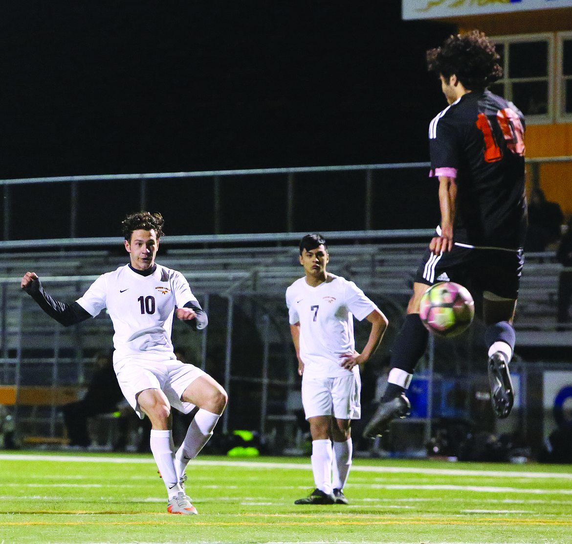 Connor Vanderweyst/Columbia Basin Herald
A free kick by Daniel Sinchuk (10) is deflected by Davis' Isaiah Rojas.