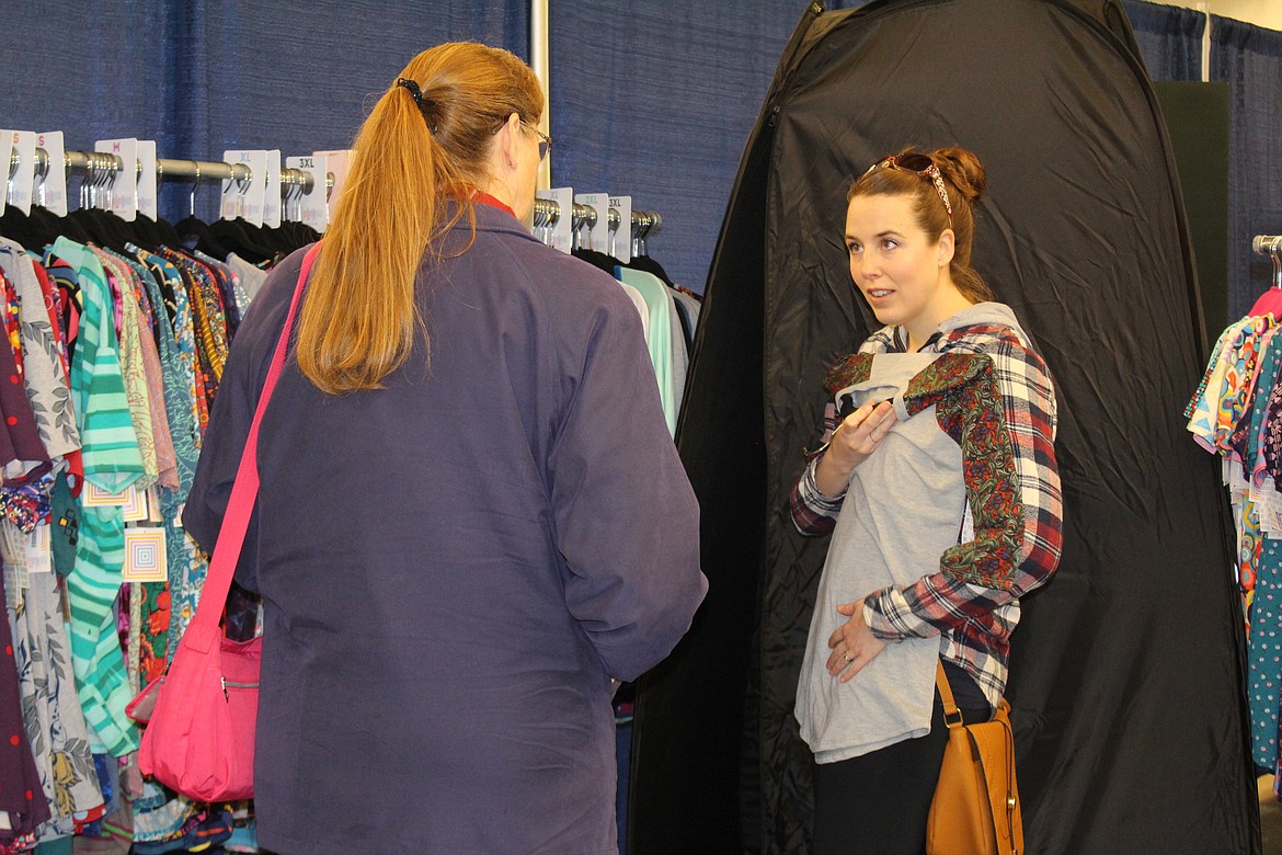 Cheryl Schweizer/Columbia Basin HeraldShoppers check out the choices at the LuLaRoe booth at the Columbia Basin Home Expo Saturday.