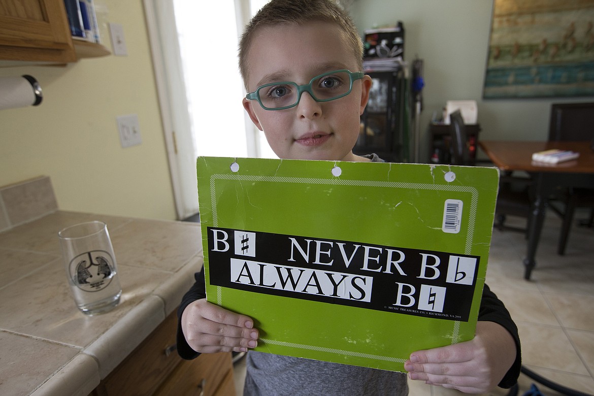 LISA JAMES/Press
Brady Schroeder shows a bumper sticker written in musical notes that reads &quot;Be sharp, Never be flat, Always be natural.&quot;