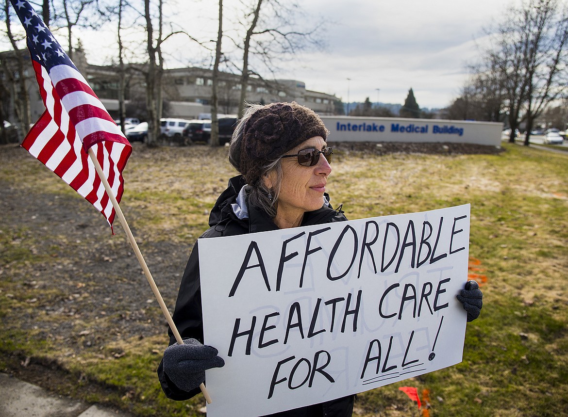 LOREN BENOIT/Press

Roz Korczyk, with Indivisible North Idaho, holds a sign outside the Interlake Medical Building Tuesday evening. Republican leaders plan a vote Thursday for whether to keep or repeal Obamacare.