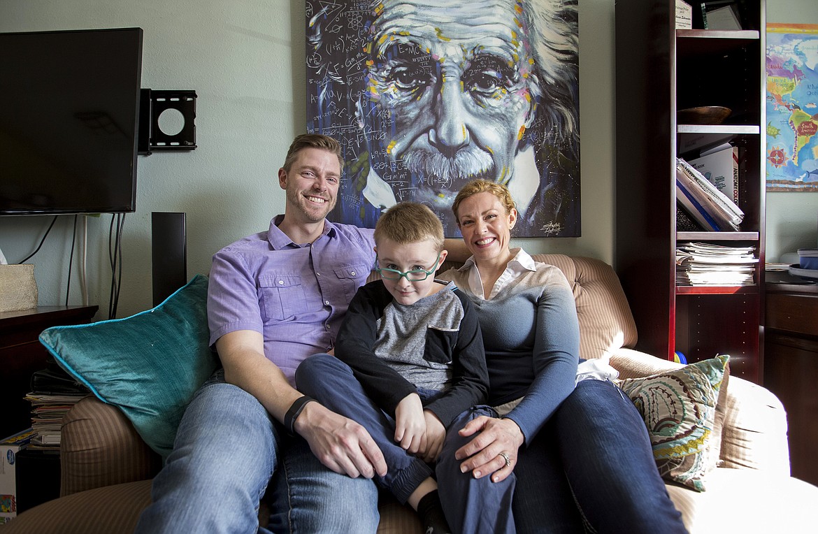 Photos by LISA JAMES/Press
Brady Schroeder, 9, poses with his parents, Rebecca and Brock Schroeder, in their Coeur d&#146;Alene home on March 10. Brady and his family have advocated for health care access and are concerned plans to repeal and replace the Affordable Care Act could hinder their ability to get Brady the medication he needs to manage his cystic fibrosis.