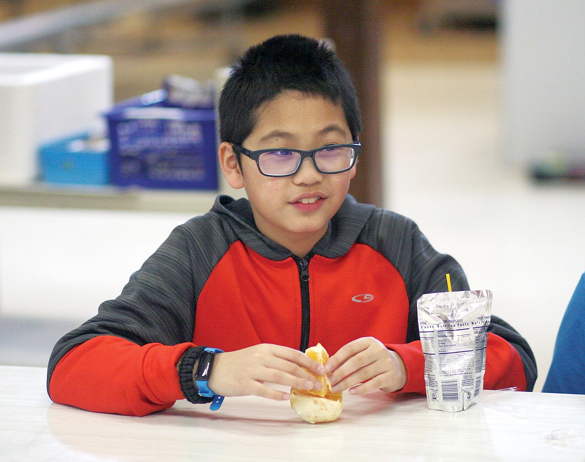 Snack time at Libby After School Program. (Elka Wood/TWN)