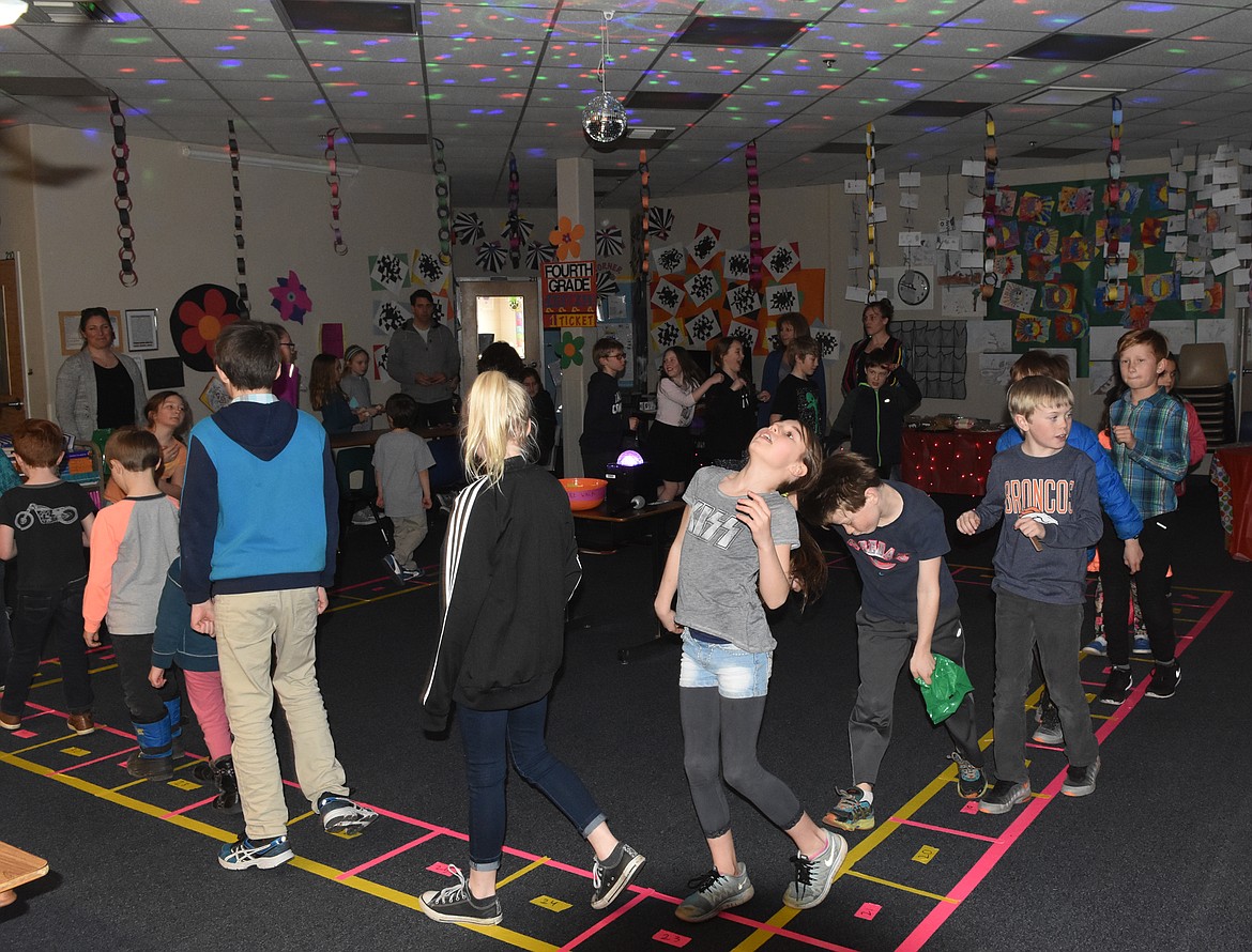 Students get their groove on at the Cakewalk at Mully Night on Thursday.