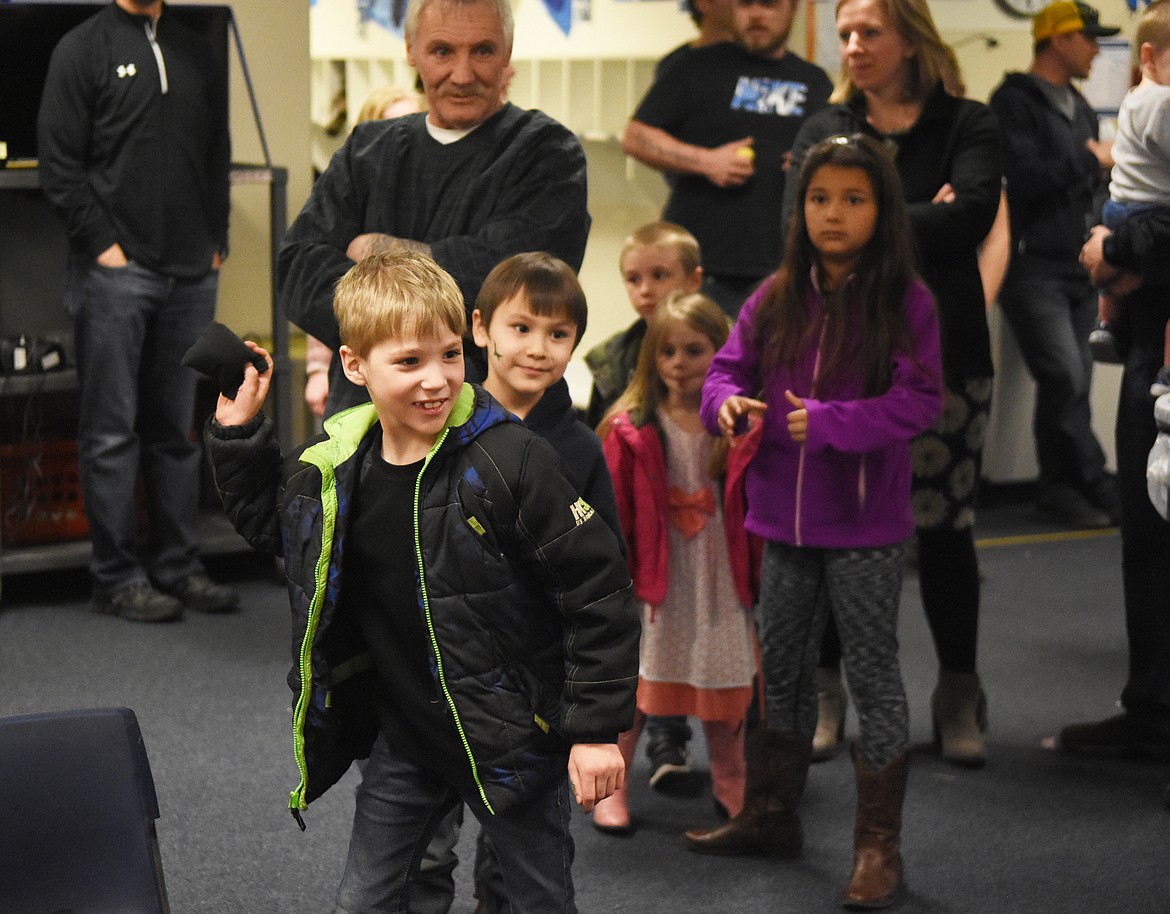 Alexander Keim launches a bean bag at some trolls at Mully Night on Thursday.