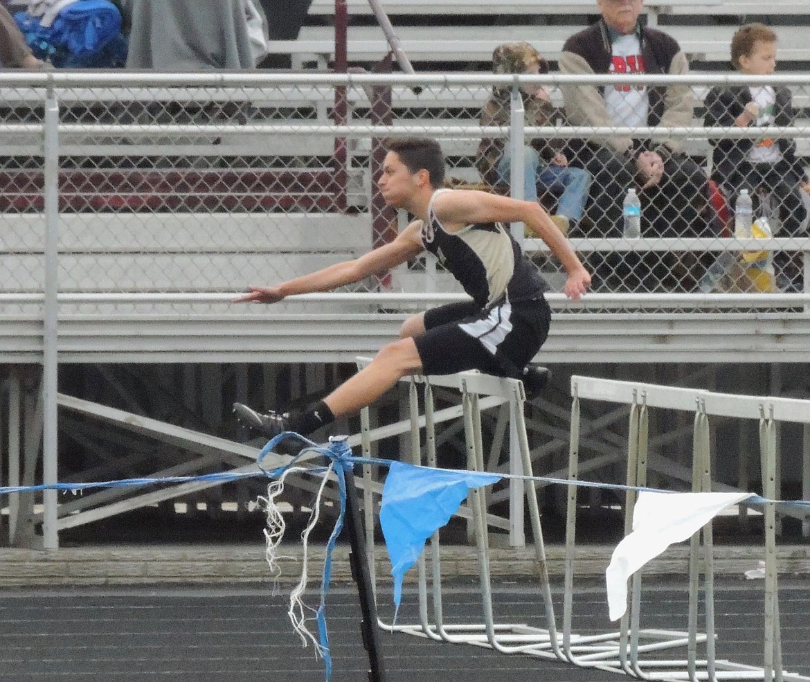 Ted Escobar/The Sun Tribune - Senior Arturo Villa, Royal&#146;s state caliber hurdler wins the 110-meter race.