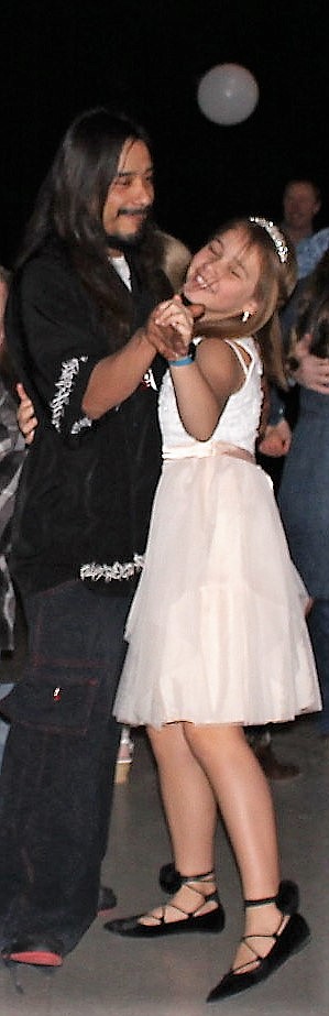 Girl Scout troop leaders took advantage of prom decorations already being in place at the school to host a father-daugher dance Sunday. (Kathleen Woodford/Mineral Independent).