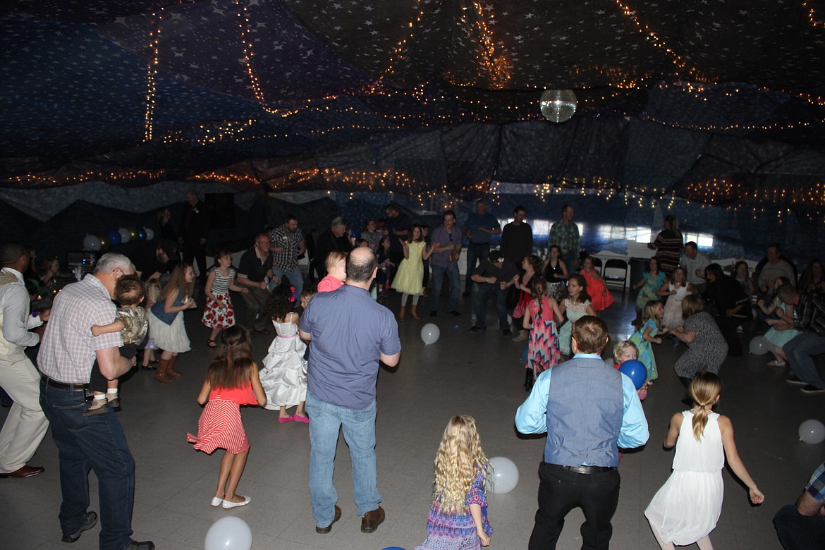 Dances for fathers and daughters included The Chicken Dance, shown here. (Kathleen Woodford/Mineral Independent).
