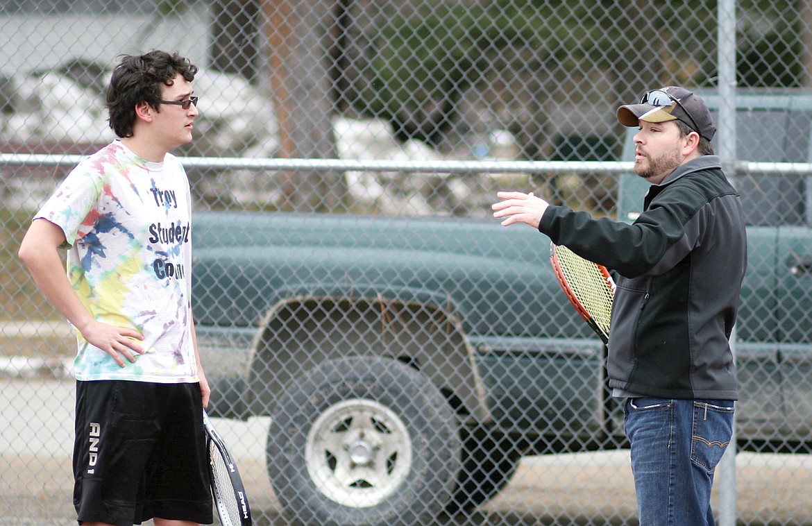 Liam Hennsley gets some tennis tips from Coach Milo Rogers. (Elka Wood/TWN)