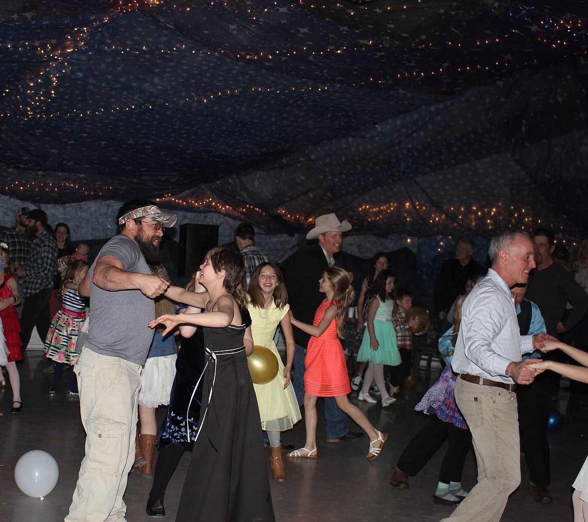 It was an afternoon of grins and laughter as fathers and daughters danced in the multipurpose room in Superior. (Kathleen Woodford/Mineral Independent).