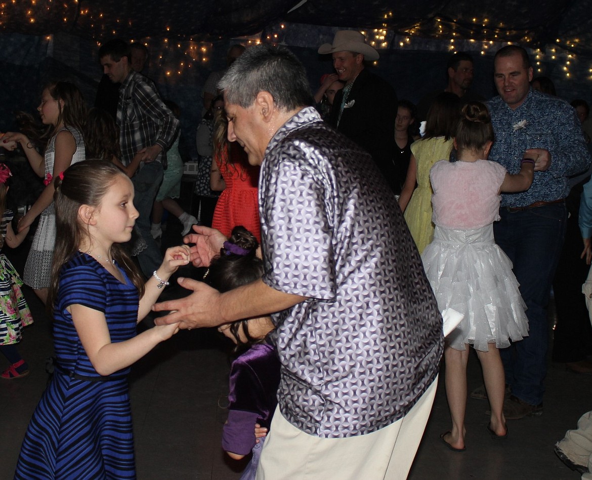 Fathers and daughters of all ages hit the dance floor last Sunday in Superior. (Kathleen Woodford/Mineral Independent).