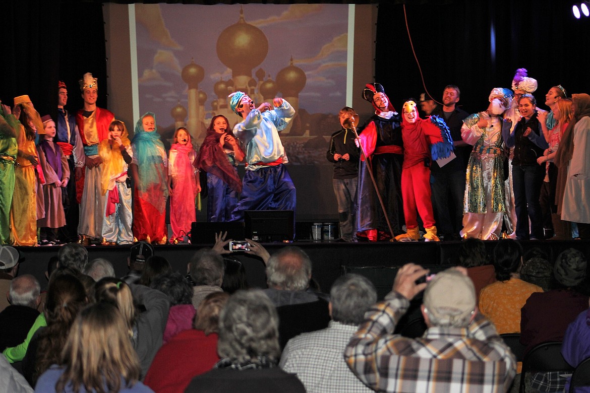 The Genie, played by Ebon Jones, takes center stage as the final musical number is sung by the entire cast during the performance of &#147;Aladdin Jr.&#148; on March 16 in St. Regis.