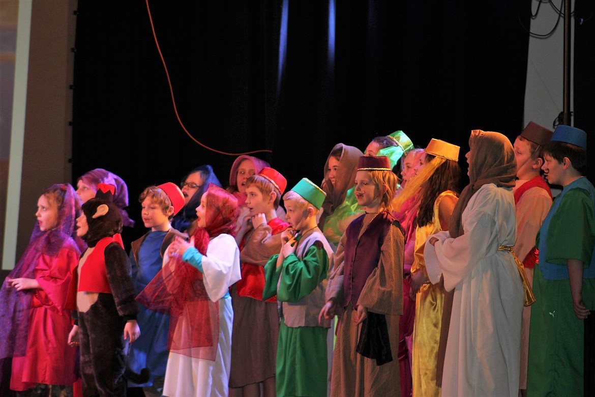 Colorfully costumed townspeople belt out a tune from Disney&#146;s &#147;Aladdin Jr.&#148; put on by the St. Regis Drama Department. (Kathleen Woodford photos/Mineral Independent)
