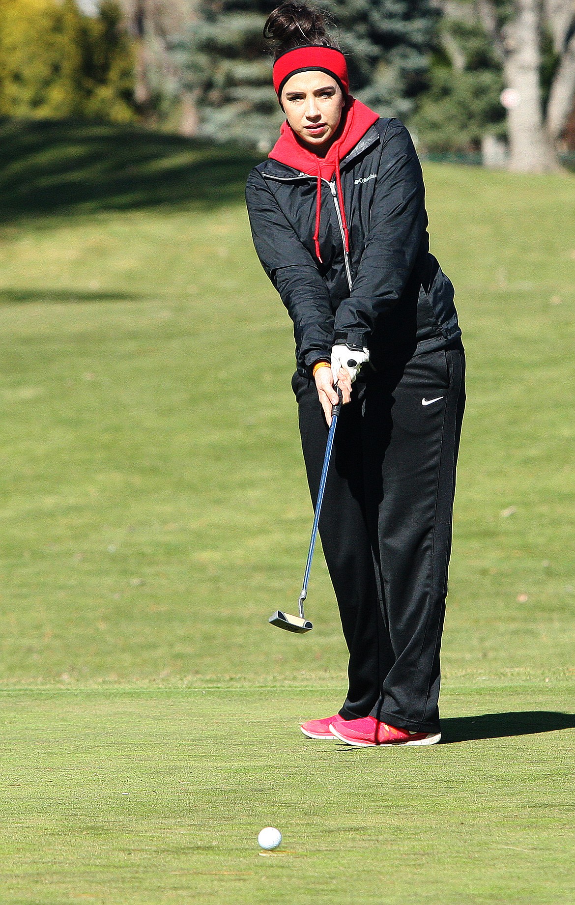 Rodney Harwood/The Sun Tribune - Othello junior Daisy Valdez watches her putt on the 10th green at the Othello Invitational.