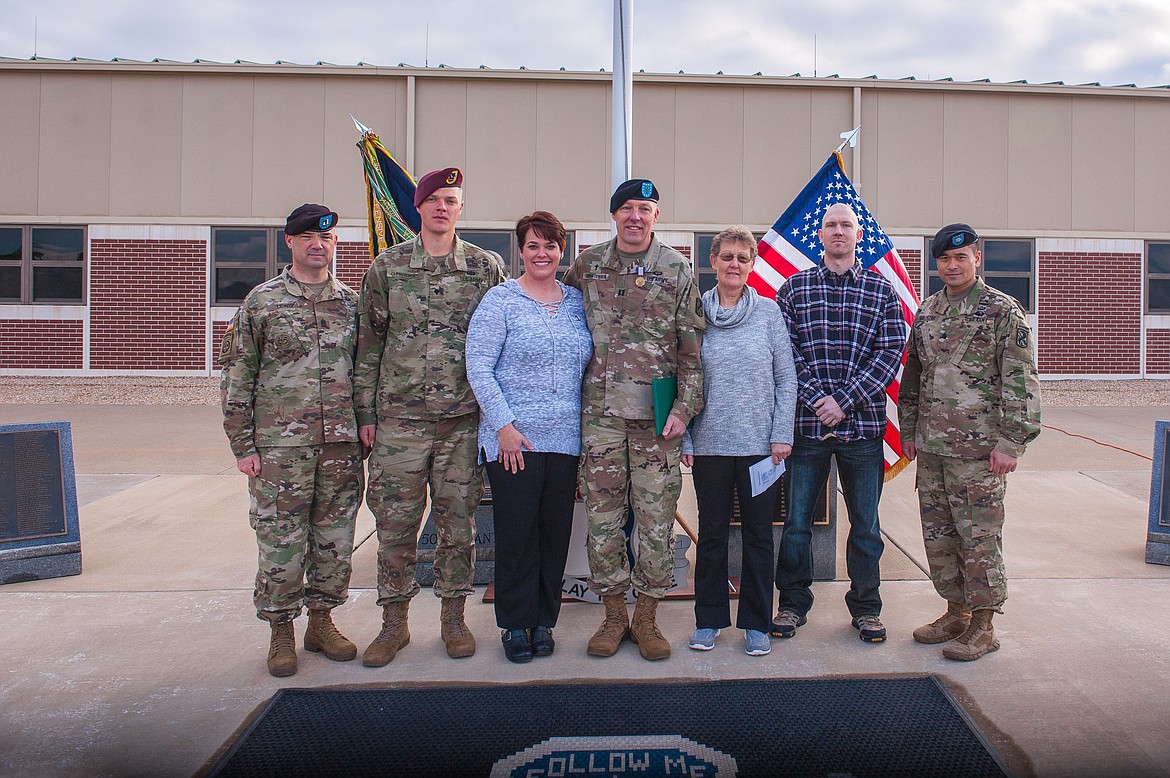 Capt. Matthew C. Christensen, center, at Fort Benning, Ga., after being awarded the Soldier&#146;s Medal on March 14. Accompanying him, at far left, is Unit Command Sgt. Major Chris Lewis. Next is Christensen&#146;s son, Spc. Caleb Christensen, who is stationed at Fort Bragg. Capt. Christensen&#146;s wife, Jessica, and his mother, Sue Heppner of Polson, flank him, followed by his brother Todd Christensen of Kalispell. At right is Lt. Col. Franklin F. Baltazar, 1st Battalion, 50th Infantry Regiment battalion commander, who presented the medal to Capt. Christensen. (Photos by Patrick A. Albright, MCoE PAO Photographer)