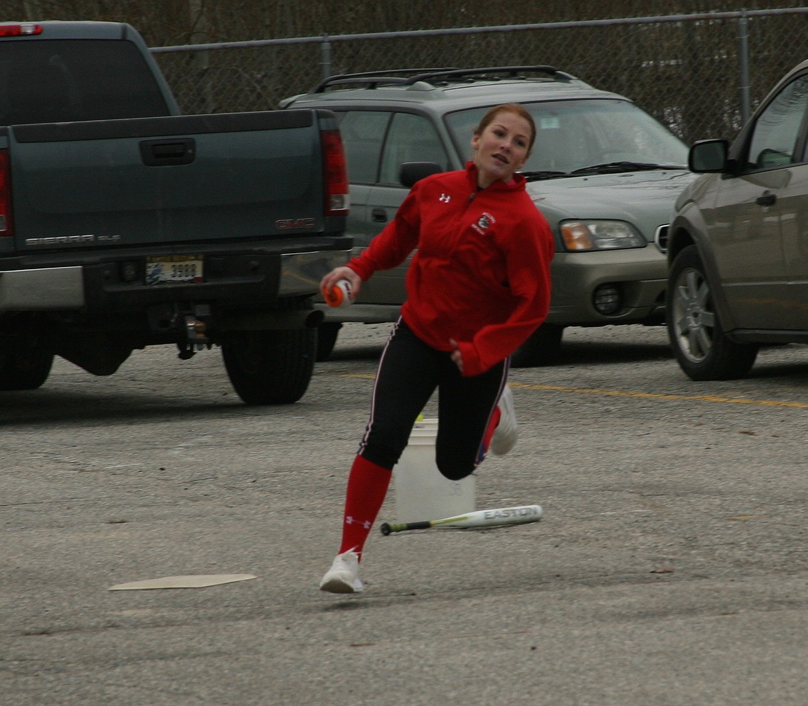 (Picture by ERIC PLUMMER)
Sophomore Bri Barlow rounds the bases as the Bulldog baseball team ventured outside for the first time on Monday, practicing on the middle school blacktop in anticipation of today&#146;s season opener in Priest River.