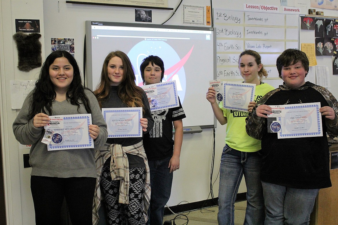 Superior NASA team members hold up their certificates for program participation where they did the project &#148;Parachuting onto Mars.&#148; Left to right: Kitty Schoolcraft, Barbara Mitchell-Garcia, Kaleb Chapman, Penny Foley, Eric Vantassel. (Kathleen Woodford/Mineral Independent).