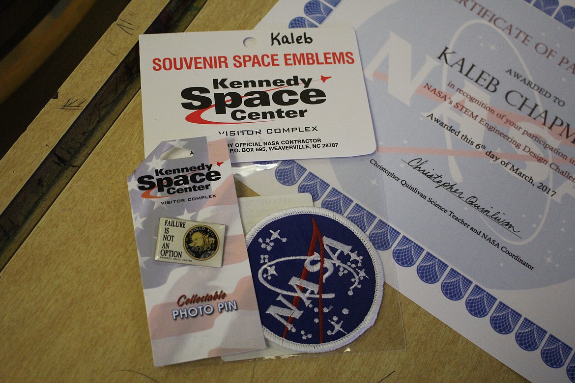 Superior students received a NASA badge, a certificate, and &#147;Failure is not an option&#148; pin on March 6. The saying is from the movie &#147;Apollo 13&#148; and is &#147;the line that reflects the attitude of mission control,&#148; according to NASA Flight Director Gene Kranz.  (Kathleen Woodford/Mineral Independent).