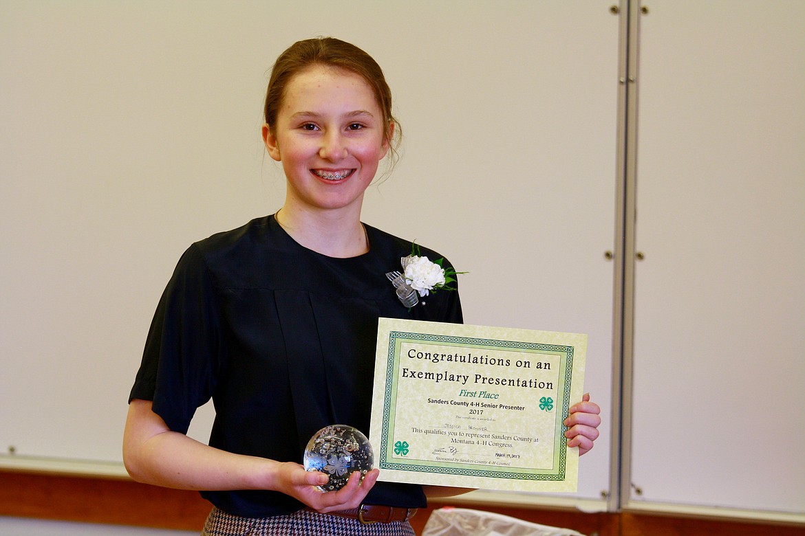 RACHEL WROBLESKI holds her award and certificate for first place in impromptu speaking during the 4-H Communication Days Finals.