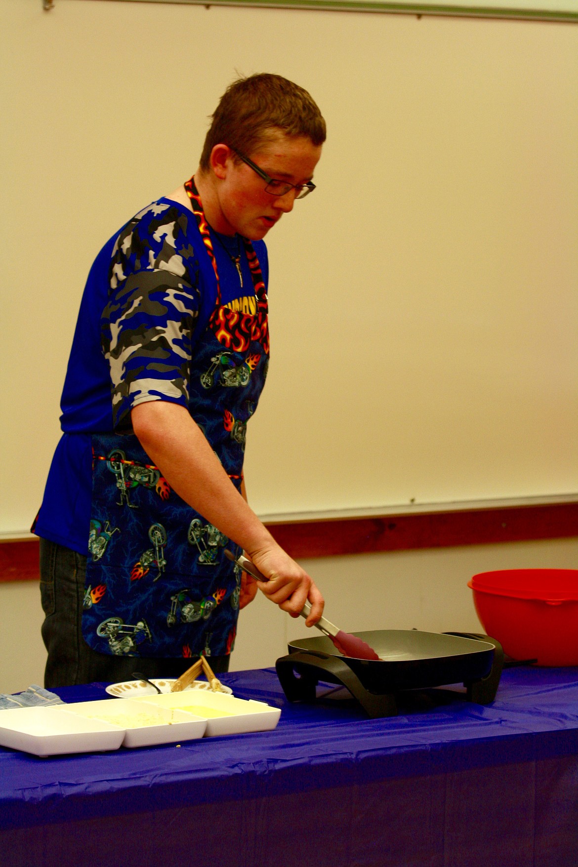 Cody Burke gives his demonstration titled Cooking Chicken Fried Steak, as part of the 4-H Communication Days Finals.