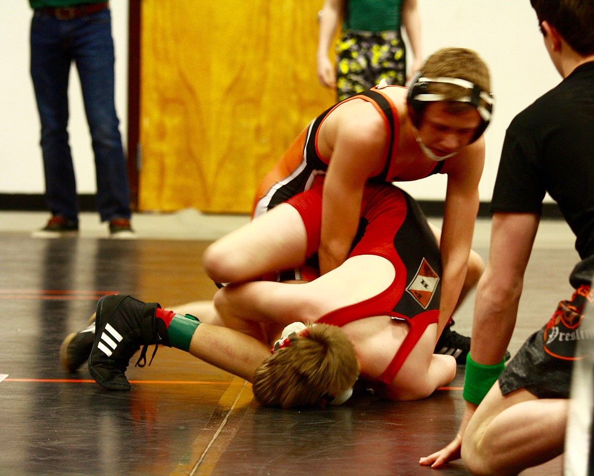 BENEDICT WATERBURY (Wildhorse Little Guy Wrestling) wrestles with John Warner (Frenchtown) during the Inter-Valley wrestling tournament in Plains. (Douglas Wliks photo/Clark Fork Valley Press)