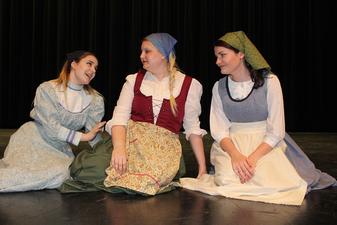 Cheryl Schweizer/Columbia Basin Herald
Sisters (from left) Chava (Katie Irvin), Tzeitel (Holly Peterson) and Hodel (Maddi Rogers) speculate what the matchmaker has in store for them &#145;Fiddler on the Roof.&#146;