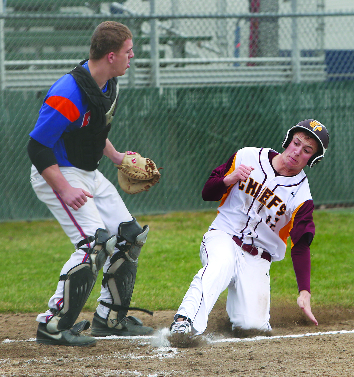 Connor Vanderweyst/Columbia Basin Herald
Moses Lake center fielder Cameron Duke slides home and scores against Graham-Kapowsin.