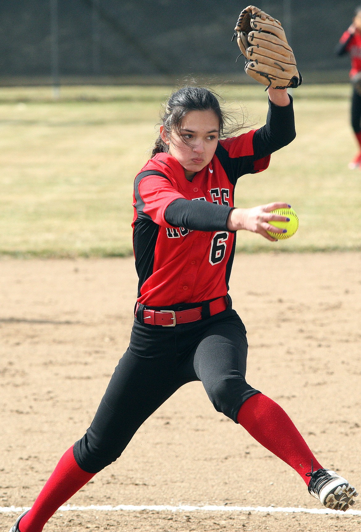 Rodney Harwood/Columbia Basin HeraldOthello freshman Alyssa Nunez delivers to the plate during the second game against Ephrata in the season opener on Saturday.