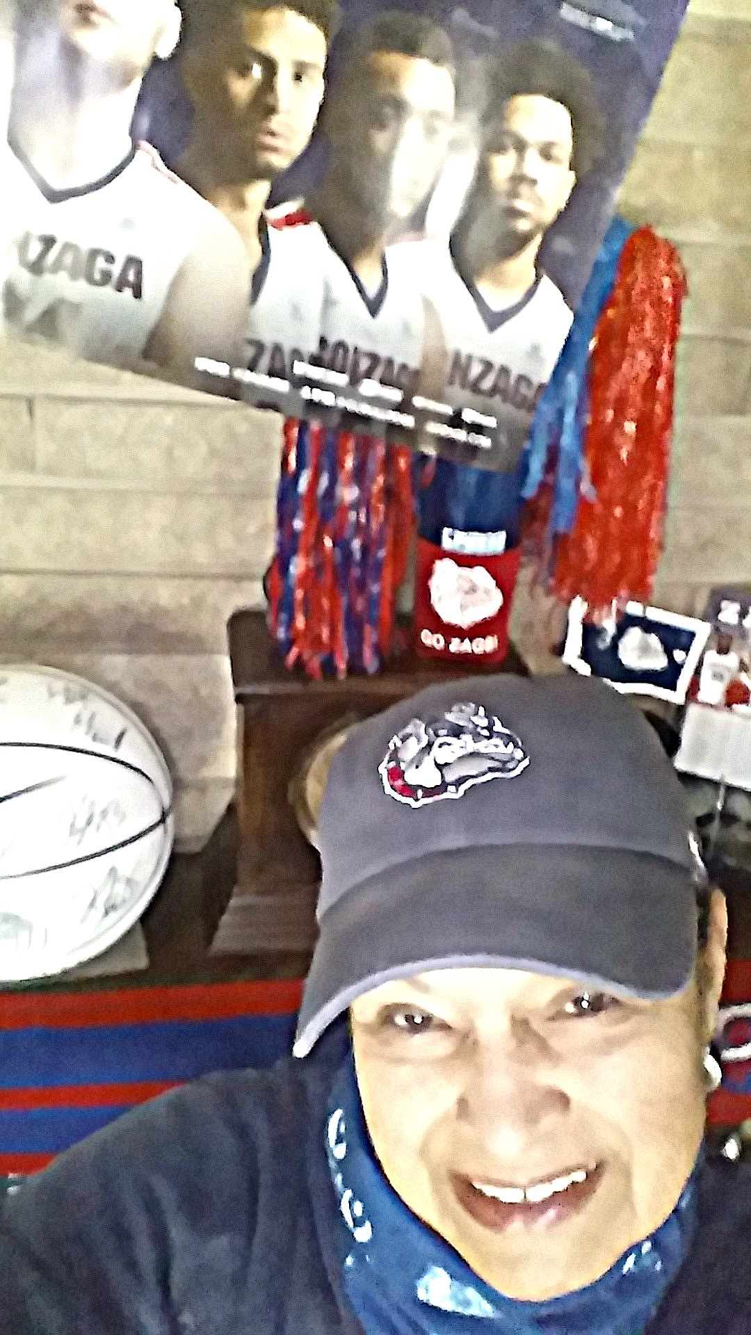 JoAnn Harvey stands in front of the Zag-decorated mantel over the fireplace in her home.