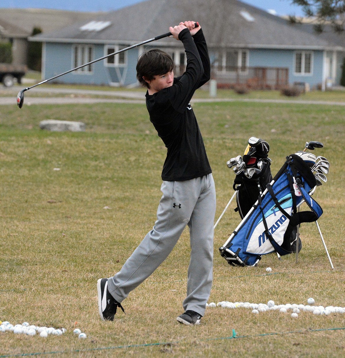 RONAN FRESHMAN Golfer Caden Rhine works on his long drive during practice Friday afternoon at Mission Valley Golf Course in Ronan. (Photo by Jason Blasco/Lake County Leader)