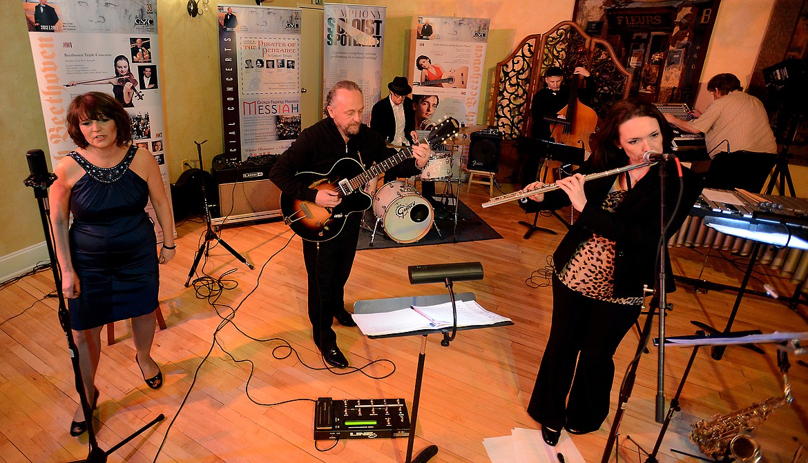 John Zoltek, center, performs with his wife Amy, left, Don Caverly on percussion, Erica von Kleist on flute and in the back right Grant Sorlie on vibraphone, at Jazz Night with the Maestro in 2014.(Brenda Ahearn/Daily Inter Lake)