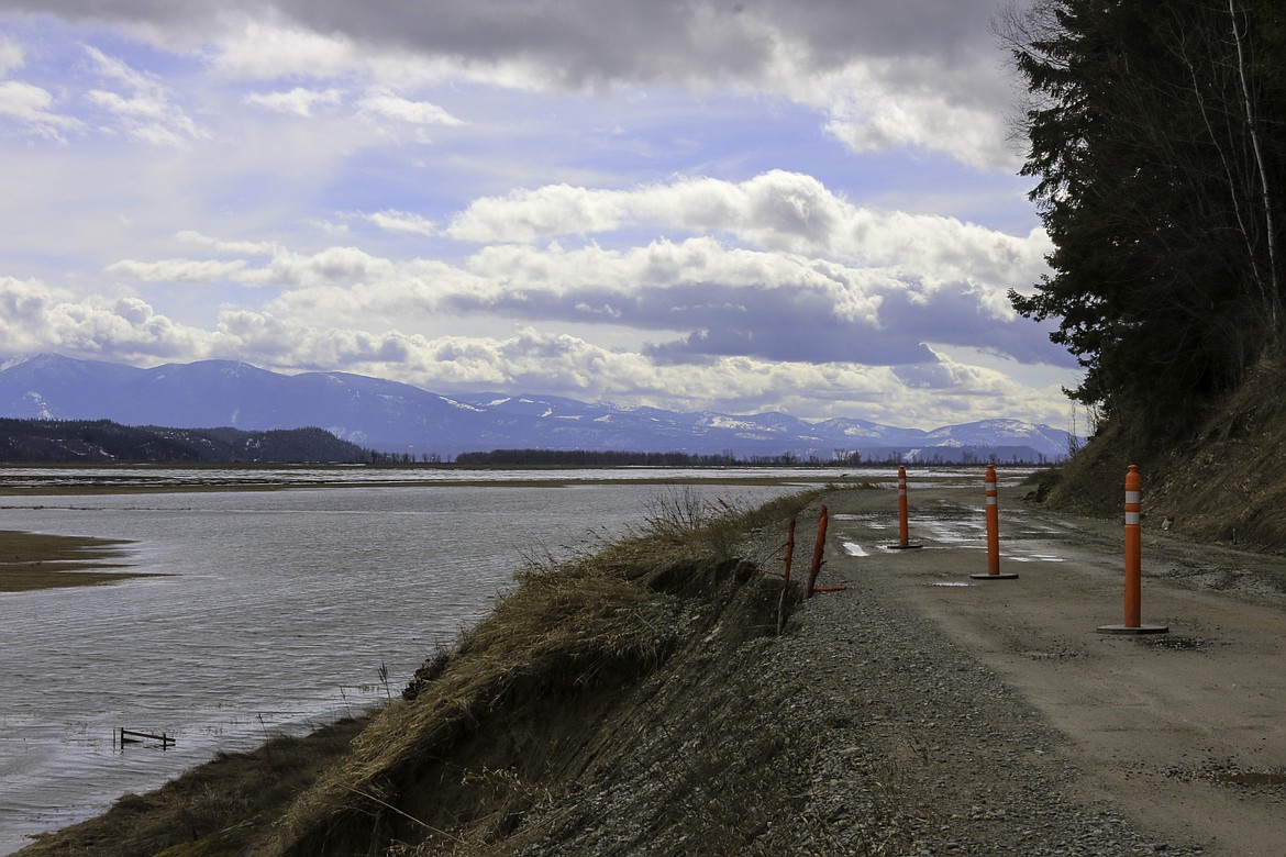 &#151;Photo by MANDI BATEMAN
One of several places along Westside Road where the road is eroding away due to days of rain and snow melt runoff.