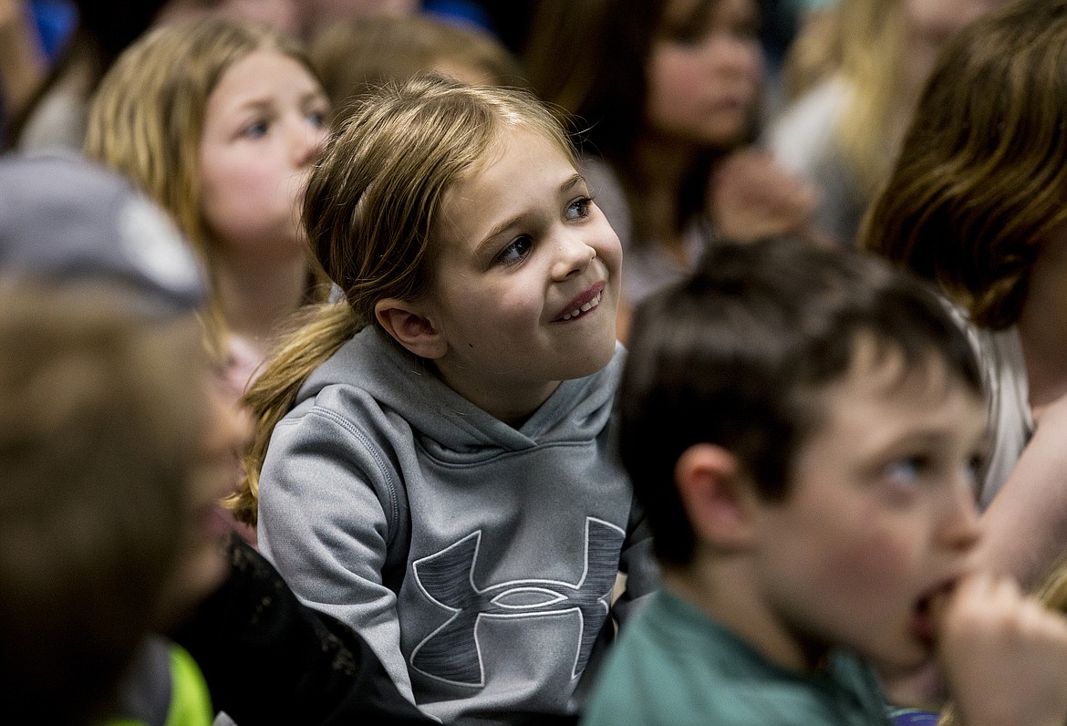 LOREN BENOIT/Press

Fernan STEM Academy Second-grader Leah Zahnow reacts to seeing an image of a baby dinosaur during a Kelly Milner Halls presentation Friday afternoon at school.