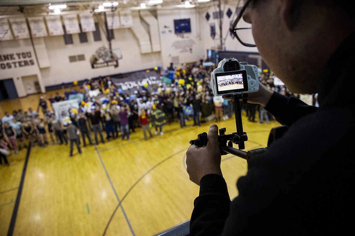 LOREN BENOIT/PressTimberlake High School senior Drew Petersen records students singing an anti-bullying cheer for a lip dub video at school.