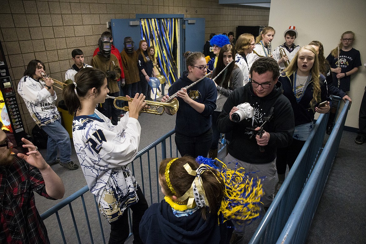 LOREN BENOIT/PressTimberlake High School senior Drew Petersen films members of the band for a lip dub music video Thursday afternoon at school.