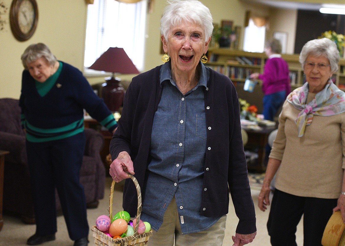 Ronnie Budge holds her basket of eggs during the Senior Easter Egg Hunt at the Whitefish Community Center on Saturday. Budge found 20 eggs. (Aaric Bryan photos/Daily Inter Lake)