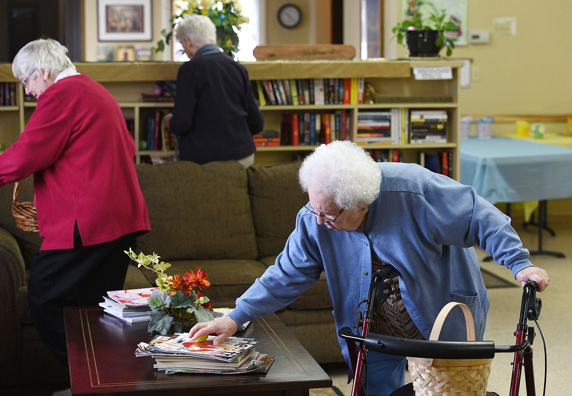 Ethel McKenzie reaches out for an egg during the Senior Easter Egg Hunt at the Whitefish Community Center on Saturday.