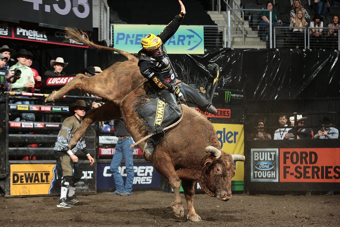 Columbia Falls bull rider Matt Triplett holds on Little Red Jacket for an 88.75-point ride in the championship round at the First Premier Bank Premier Bankcard Invitational last weekend in Sioux Falls, South Dakota. Triplett won the event, his first win on the Built Ford Tough Series since 2015. The PBR will be in Billings this weekend. (Professional Bull Riders courtesy photos)