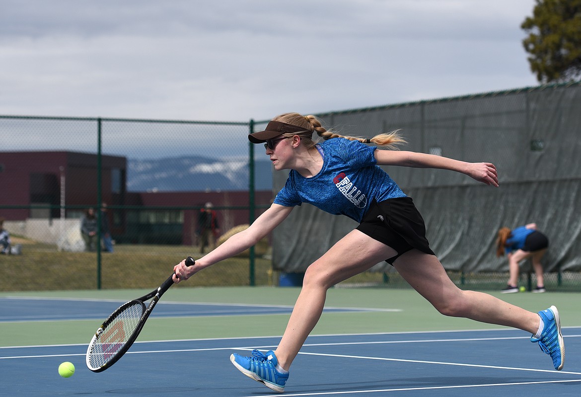 Columbia Falls #1 Molly Schmit lunges for a ball during her match against Whitefish&#146;s Hannah Madsen at Flathead Valley Community College on Thursday. (Aaric Bryan/Daily Inter Lake)