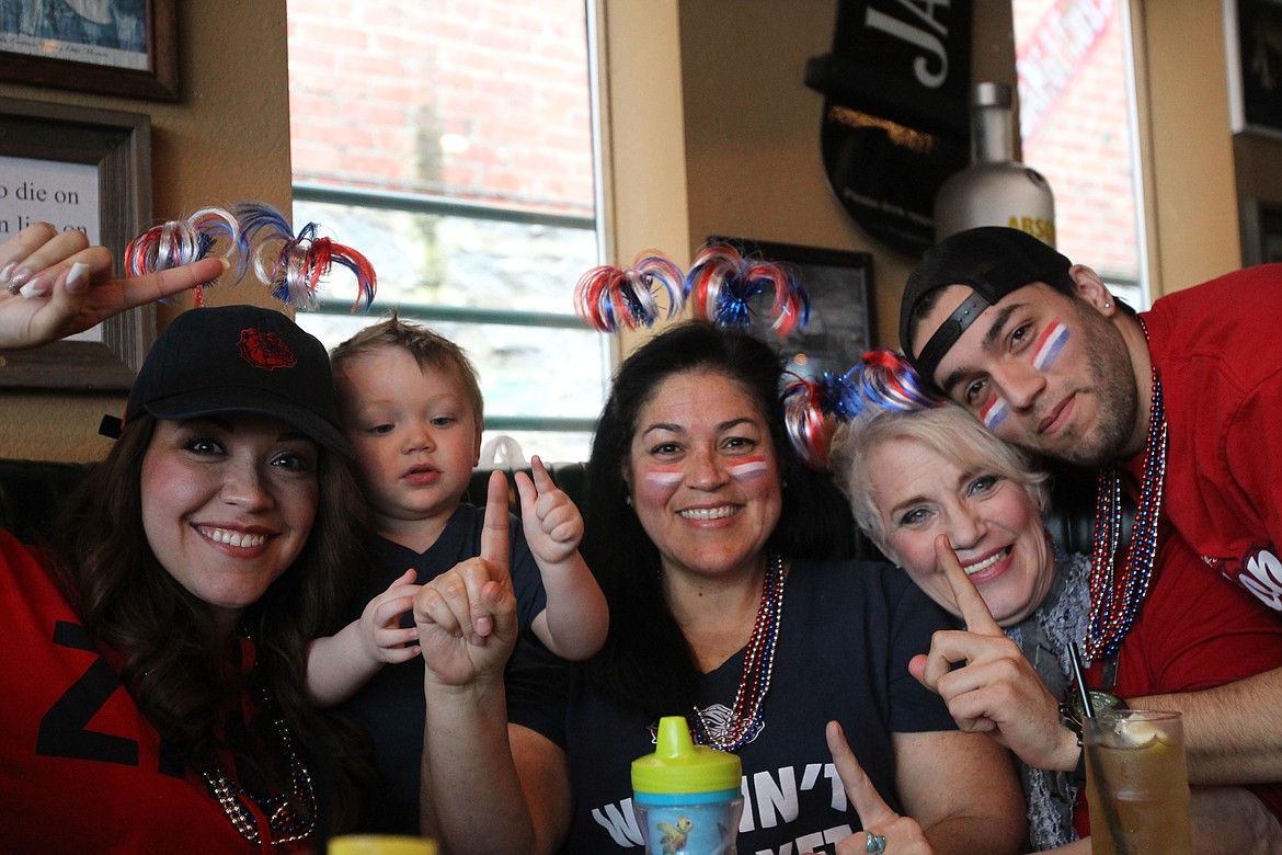 DEVIN HEILMAN/Press
Christy-Lee Comrie of Post Falls, left, and her 20-month-old son, Greyson, joined her mom Trish, good friend Lynne Blackwood and brother Austin to watch the Gonzaga game at Crickets in Coeur d'Alene. &quot;The culture is like the '12th man' of the Seahawks,&quot; Trish said.