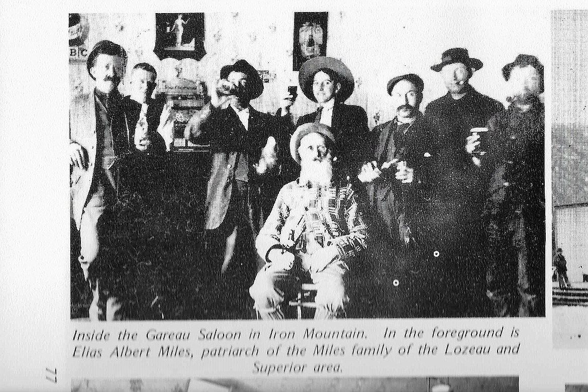 An old photo was found of Elias Albert Miles, the caption reads: Inside the Gareau Saloon in Iron Mountain. In the foreground is Elias Albert Miles, patriarch of the Miles family of the Lozeau and Superior area. (Photo courtesy of Mineral County Historical Society).